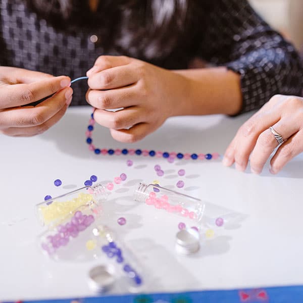 Child working on beading